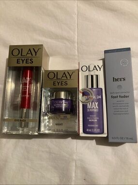 New never opened OLAY Eyes and Skincare Set and hers dark spot corrector.